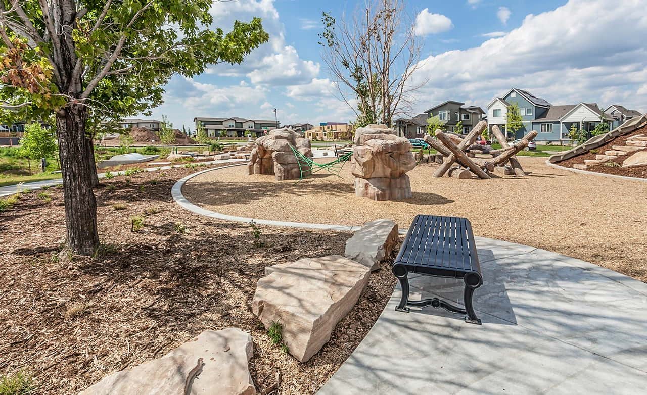 Trailside on Harmony Park with Play Structures and Pathway Park area with modern play structures and pathway in Trailside on Harmony, surrounded by residential homes.