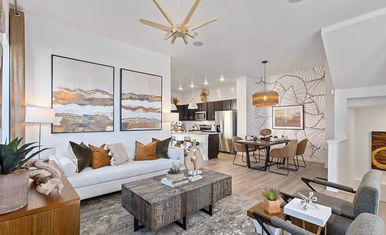 Elegant Living Room in Trailside on Harmony Community Elegant living room with abstract art, wooden accents in Trailside on Harmony community, contemporary decor.